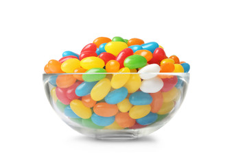 Glass bowl of tasty bright jelly beans isolated on white