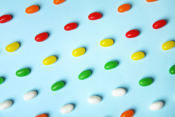 Flat lay composition with jelly beans on color background