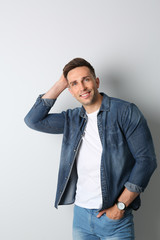 Portrait of handsome man on light background