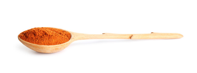 Spoon of ground pepper isolated on white