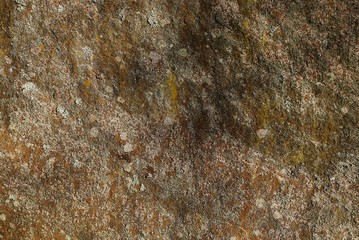 gray brown stone texture from a piece of dirty granite in the wall