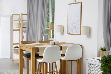 Modern room interior with wooden dining table