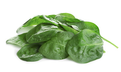 Heap of fresh green healthy baby spinach leaves isolated on white
