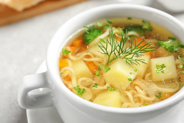 Dish of fresh homemade vegetable soup on table, closeup