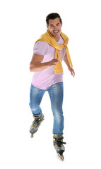 Handsome young man with inline roller skates on white background