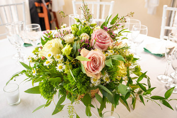 Event decoration with flowers at indoor ceremony