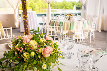 Event decoration with flowers at indoor ceremony