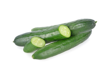 whole and sliced fresh Japanese cucumbers on white background