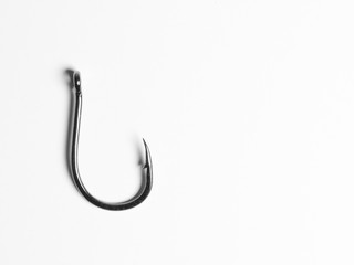 Single fishing hook on white background