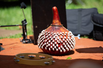 SHekere authentic african instrument outdoor shaker at day