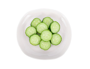 sliced fresh Japanese cucumbers in white plate on white background