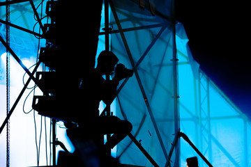 Unrecognizable silhouette of a photographer taking a photo