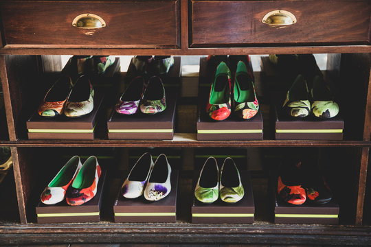 Close up of shoes with floral pattern in rack