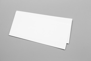 Blank portrait mock-up paper. brochure magazine isolated on gray, changeable background / white paper isolated on gray