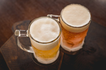 two mugs of chopp on the table