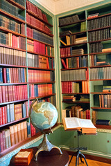 old library with many books on the shelf in a home