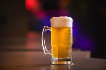 mug full of chopp, with chopp pilsen on a rustic table
