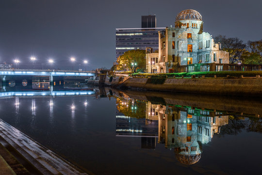 View of Genbaku Dome reflected in lake at night
