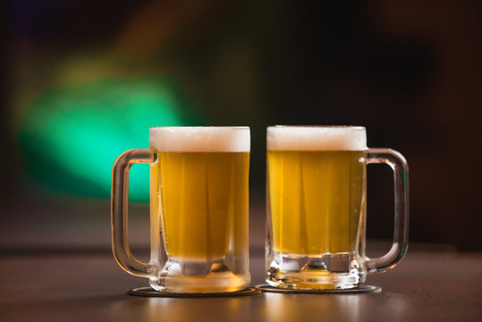 two mugs of chopp on the table