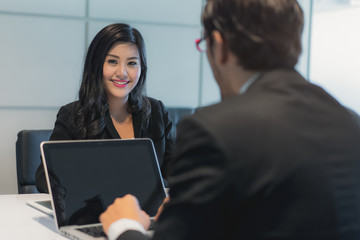 Asian woman answering question interview during job application.