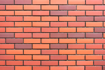 Obraz premium Decorative brick wall オレンジ色の壁面のテクスチャー