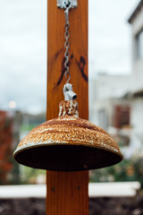 Rusty light fixture hanging on a wooden column