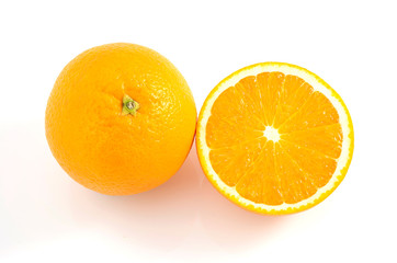 Orange is a fruit that contains vitamins. C. high in orange, cut in half With a shadow on a white background