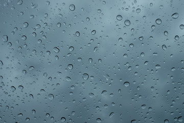 Raindrops on the window close up. rain drops on the glass macro. water drops falling down on window. rainy day