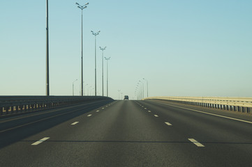 Wide highway. long roadway. road going into the distance