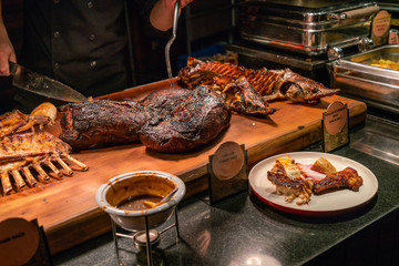 Grilled pork and lamb ribs in buffet dining restaurant