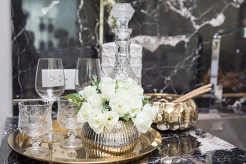 brandy bottle and Glass in Brass Tray on  counter bar