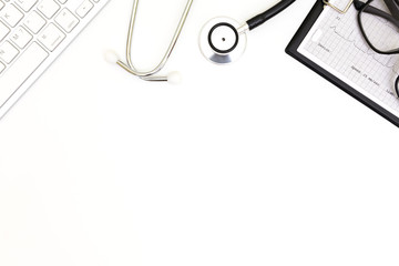 Stethoscope, Top view of doctor's desk table, blank paper on white background, above view doctor work tools on white, medical doctor desk concept.
