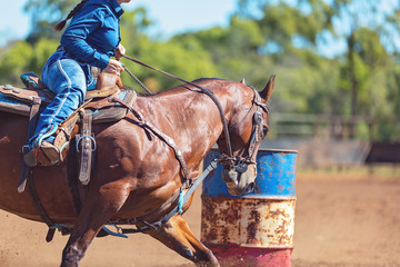 Horse And Rider Competing In Barrel Race At Outback Country Rodeo