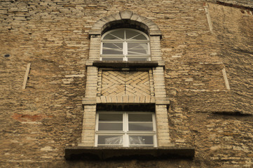 Fototapeta na wymiar Old brick wall with windows background