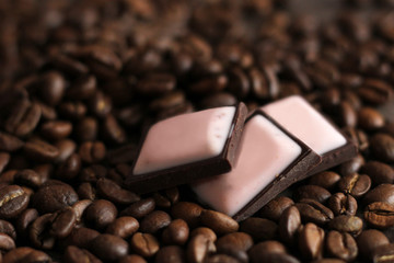 Pieces of dark pink chokolate and coffee beans