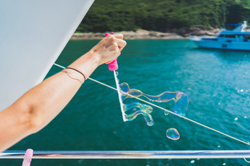 blowing bubbles off a boat