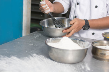 hand of chef stir dough