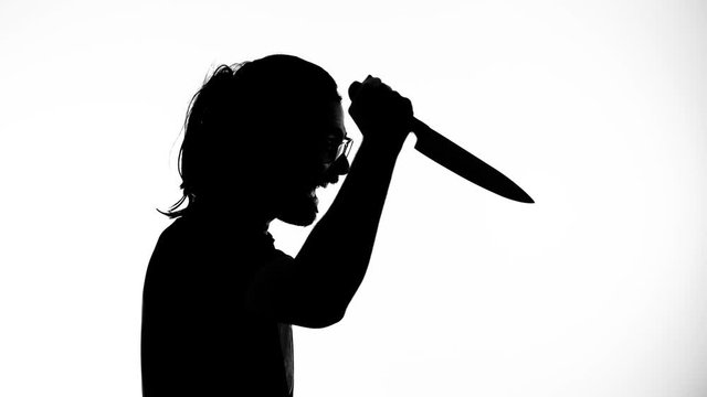 Silhouette of a dangerous killer with a knife