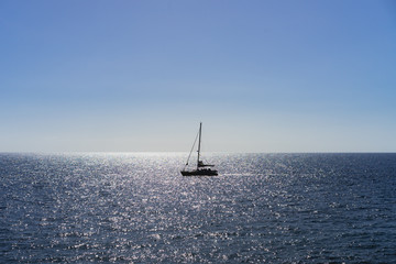 Small boat in harsh sunlight