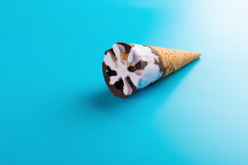 side view sweet potato flavor ice cream cone on a blue background