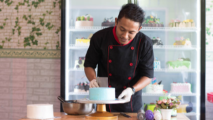 Fototapeta na wymiar asian male pastry chef