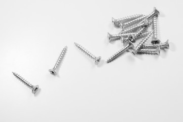 Pile of screws on a white background