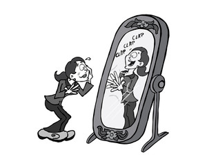 Woman looking at her reflection in the mirror giving herself praise
