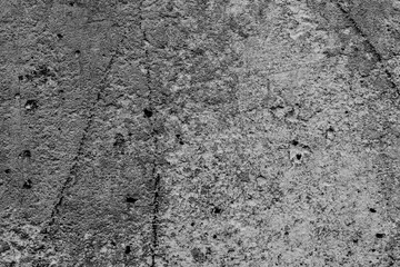 Texture of a concrete wall with cracks and scratches which can be used as a background