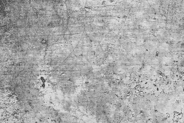 Texture of a concrete wall with cracks and scratches which can be used as a background