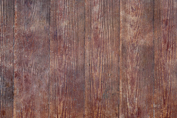 The texture of dark wood planks vertical closeup.