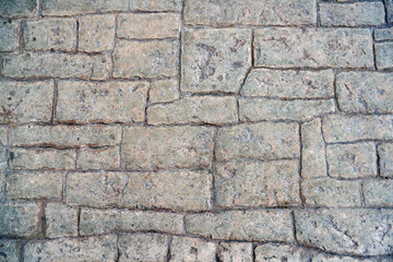 The texture of the road pavement gray closeup.