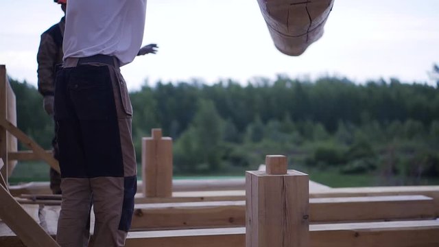 Installation of bar joists for building houses. Clip. Elements of timber construction materials