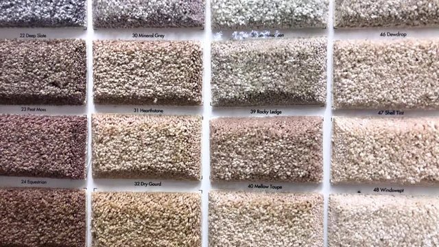 Colorful square carpet samples in the store made for the interior residential and commercial decoration