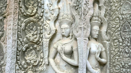Fototapeta na wymiar two devata carvings at ta prohm temple